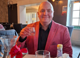 Picture of Andy Lloyd in pink suit