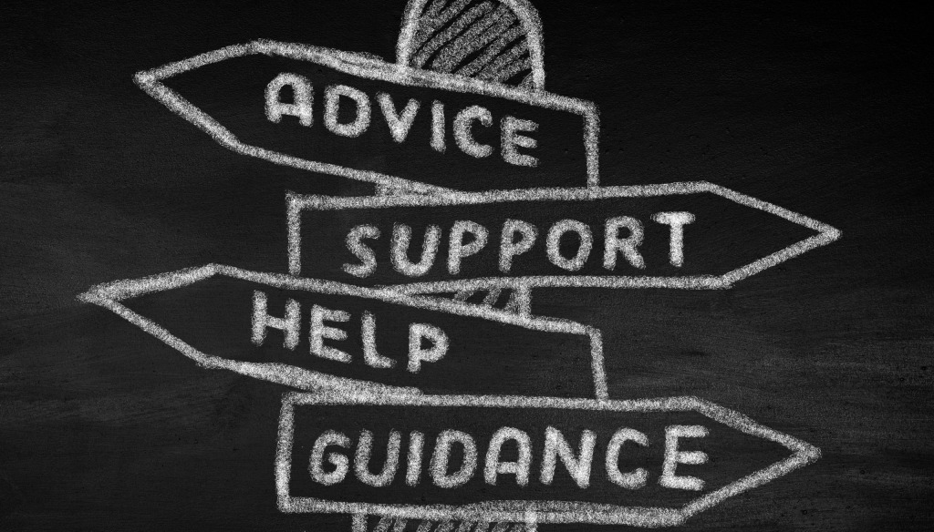 The words advice support help and guidance on a chalk board