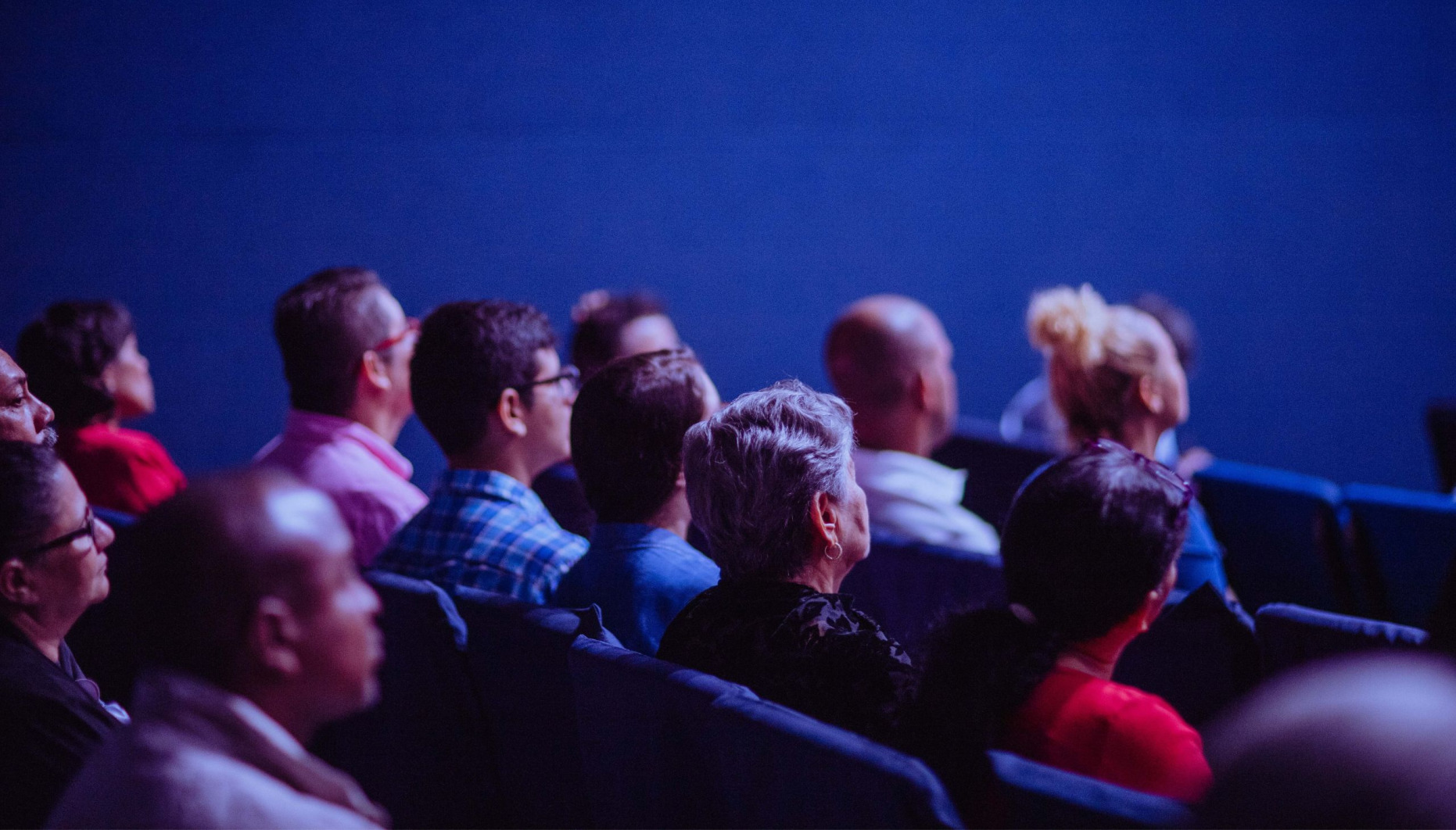An audience sitting in a room