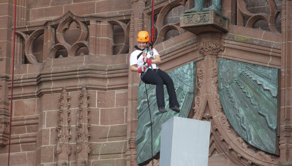 Lili abseiling down Liverpool Cathedral