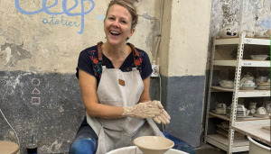 Woman doing pottery making.