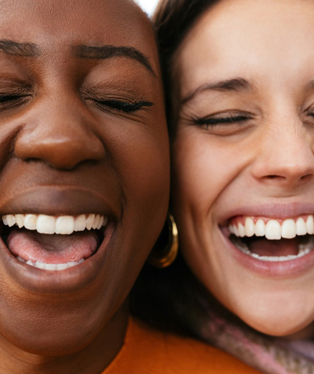 Close up of two women laughing