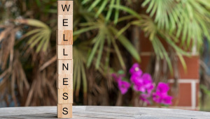 The word wellbeing written on a stack of wooden blocks