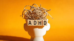 Abstract Representation of ADHD with Tangled Threads and Letter Blocks on a White Head Figure, Symbolising Brain Activity and Mental Health