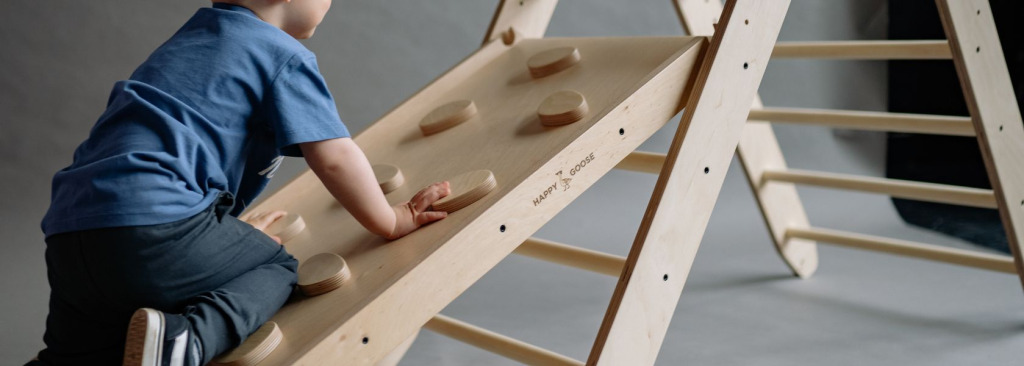Boy climbing on a climbing frame