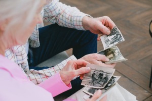 Two people looking at old photographs